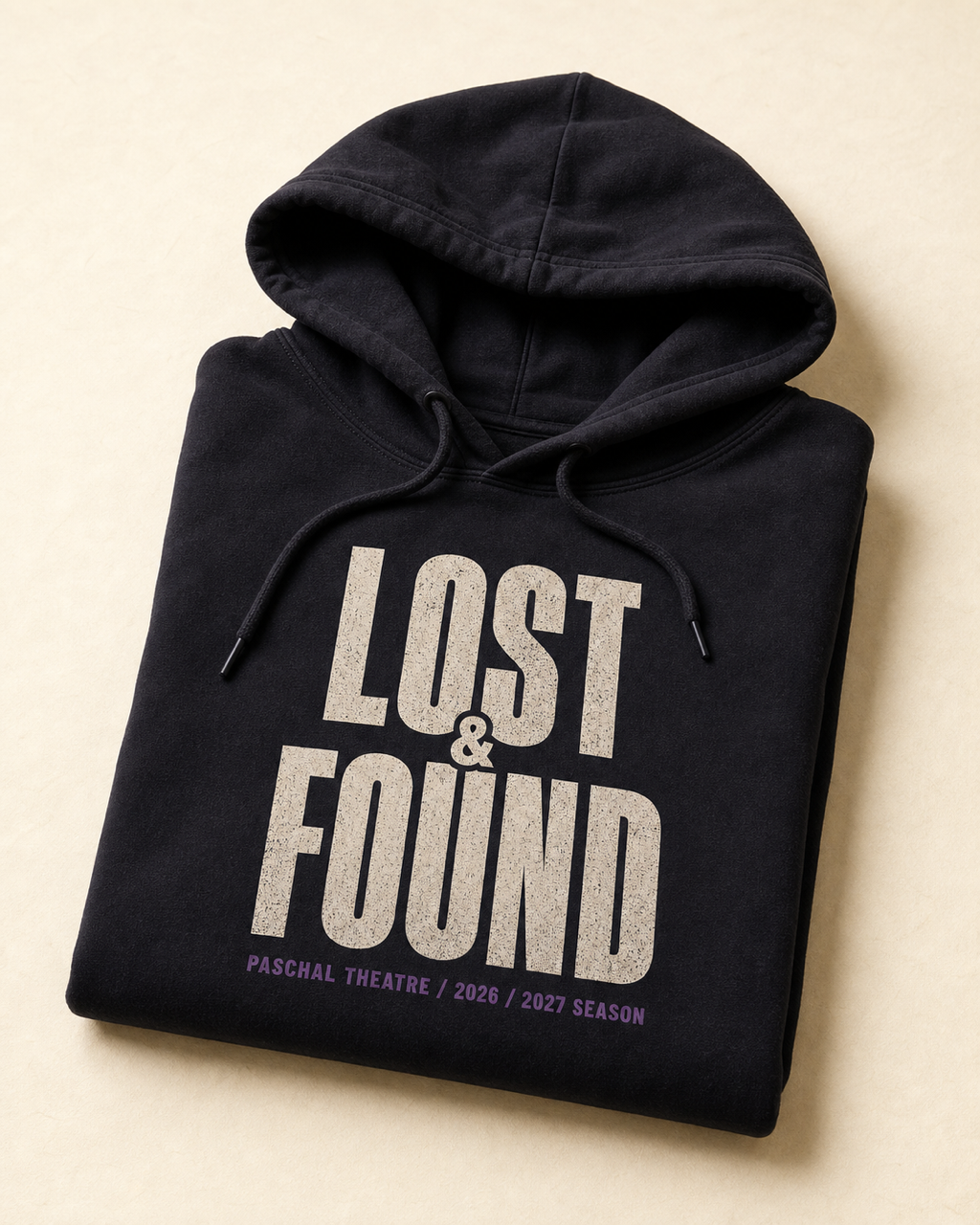 Deep stage-ink hoodie with the Lost and Found wordmark across the chest.